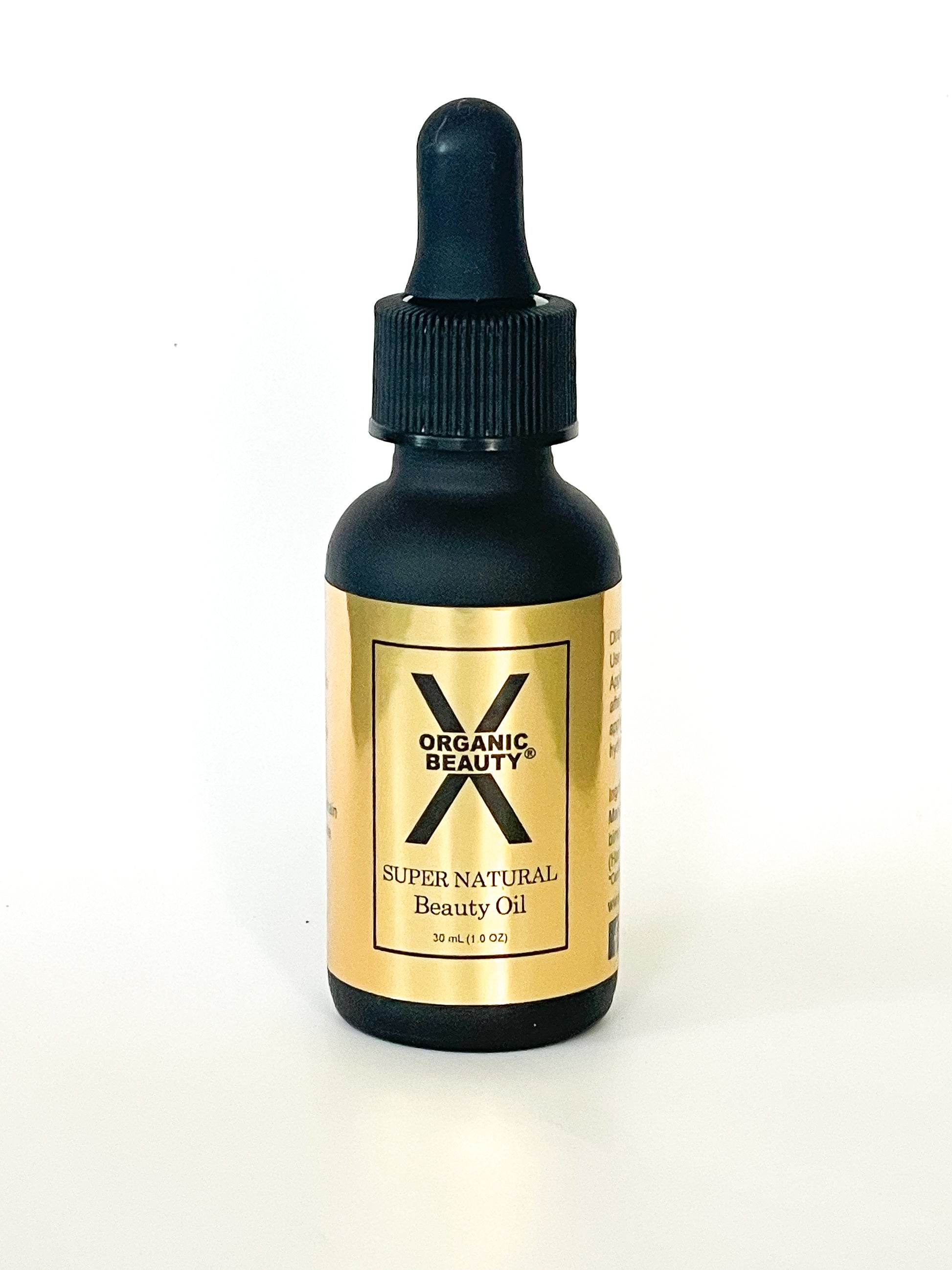 A one ounce bottle of X Organic Beauty's Super Natural Beauty Oil on a white background