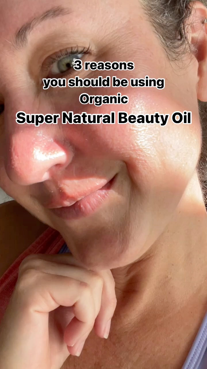 Close-up of a smiling woman's face with overlaid text reading '3 reasons you should be using Organic Super Natural Beauty Oil': 1. Softer/Smoother skin. 2. Brighter Skin. 3. More Evened Skin Tone.