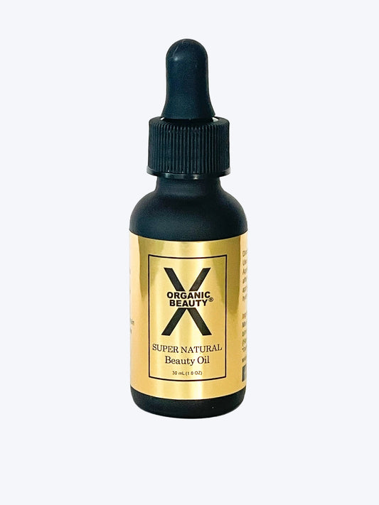 A one ounce bottle of X Organic Beauty's Super Natural Beauty Oil on a white background